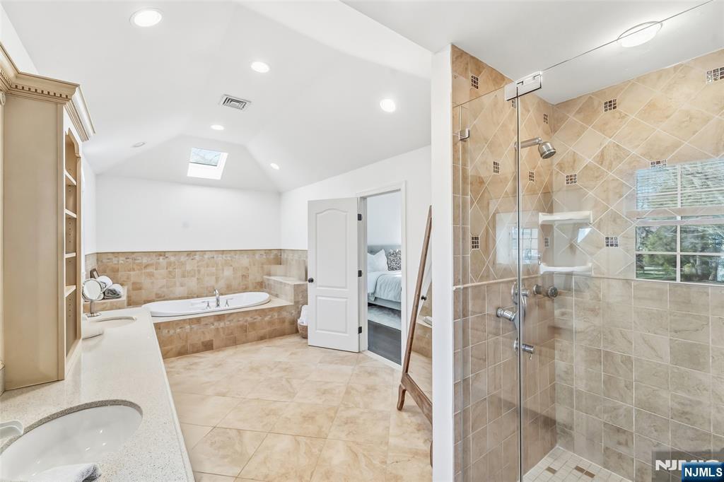 27 Pine Hill Road Old Tappan, NJ 07675 - Photo 38 of 50 a large bathroom with a tub and shower