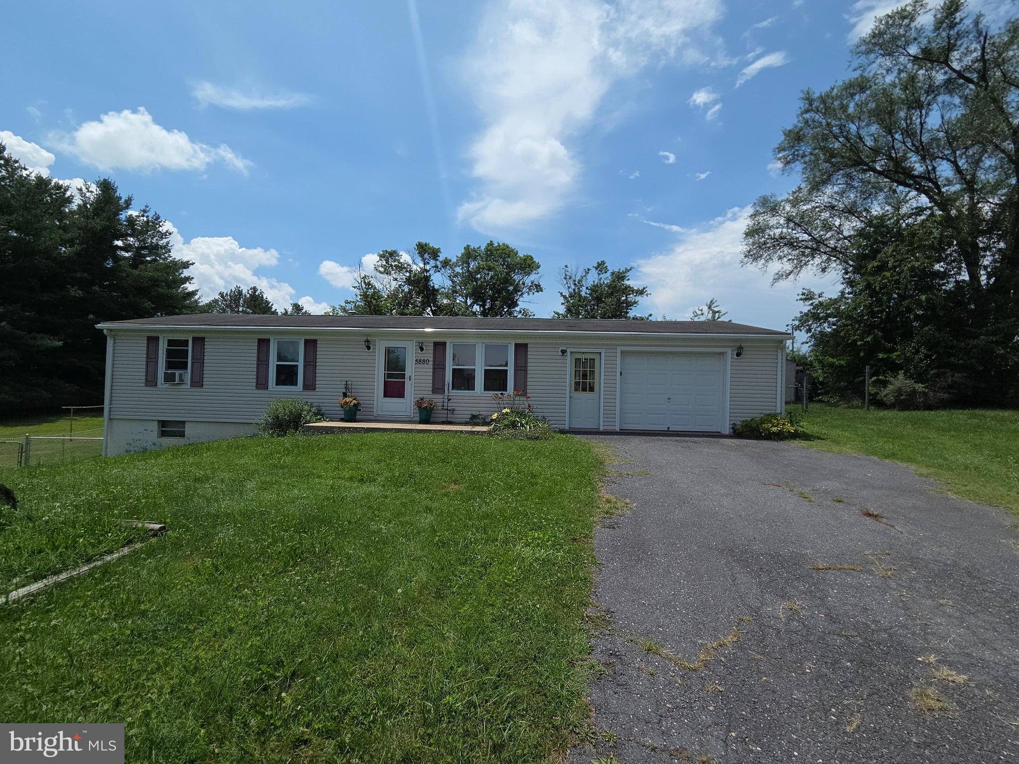 a view of a house with a backyard