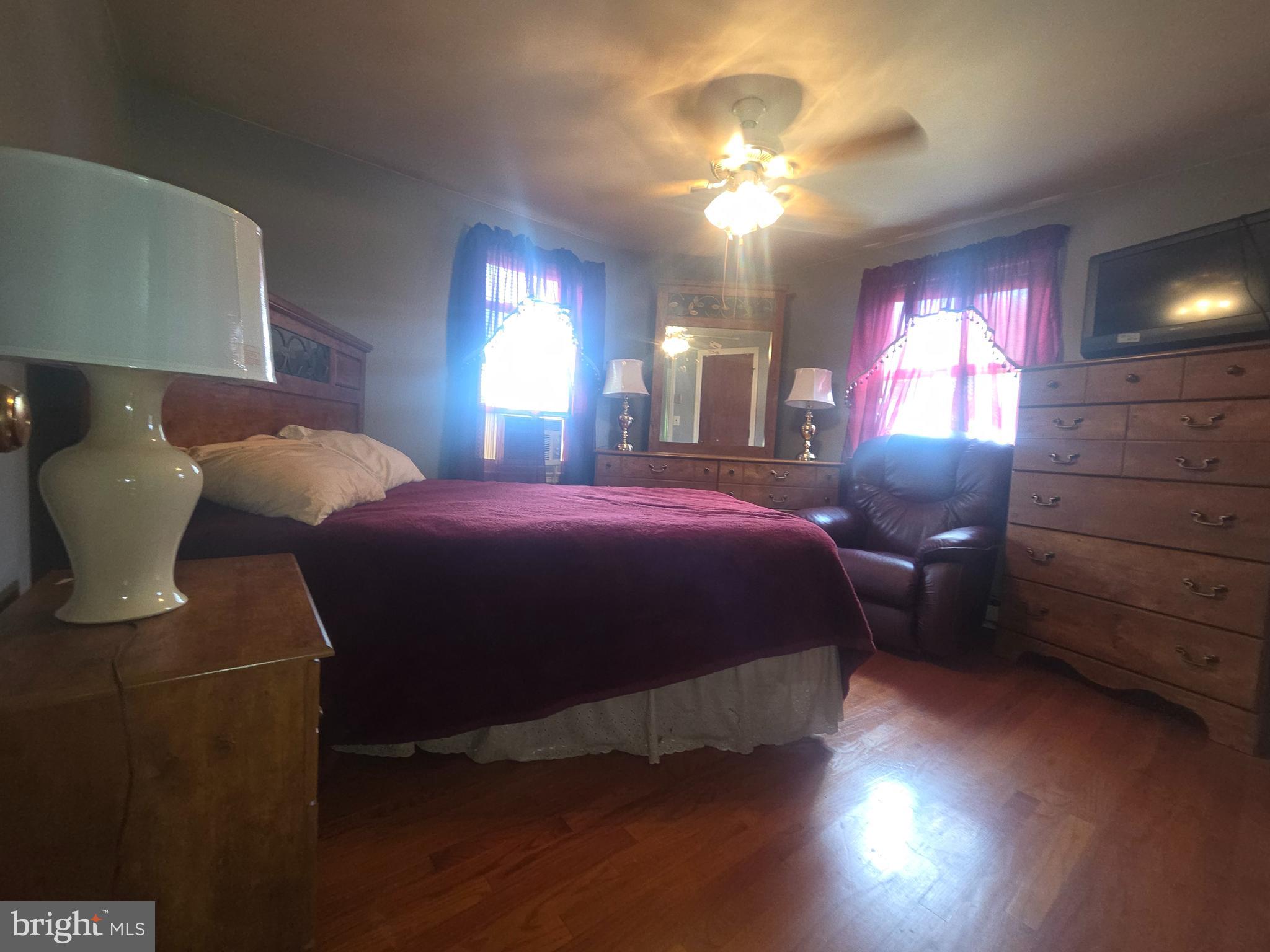 5880 Cardinal Street Mount Jackson, VA 22842 - Photo 12 of 44 a bedroom with a bed and a chandelier