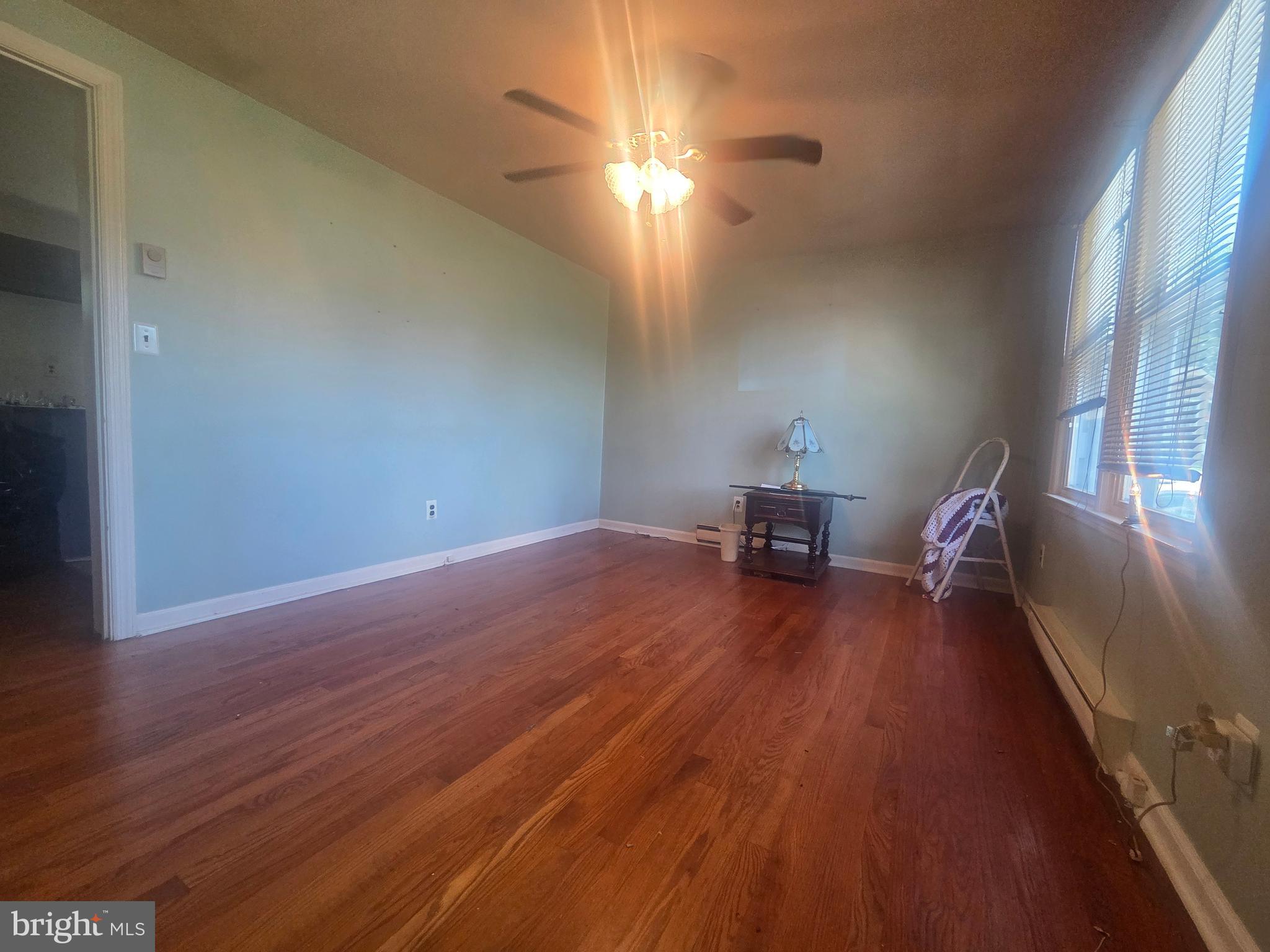 5880 Cardinal Street Mount Jackson, VA 22842 - Photo 18 of 44 a room with wooden floor and furniture
