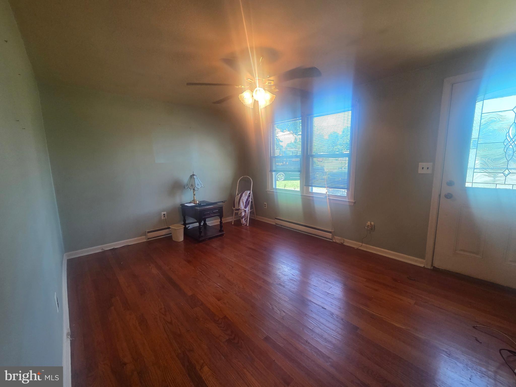 5880 Cardinal Street Mount Jackson, VA 22842 - Photo 19 of 44 a view of empty room with wooden floor and fan