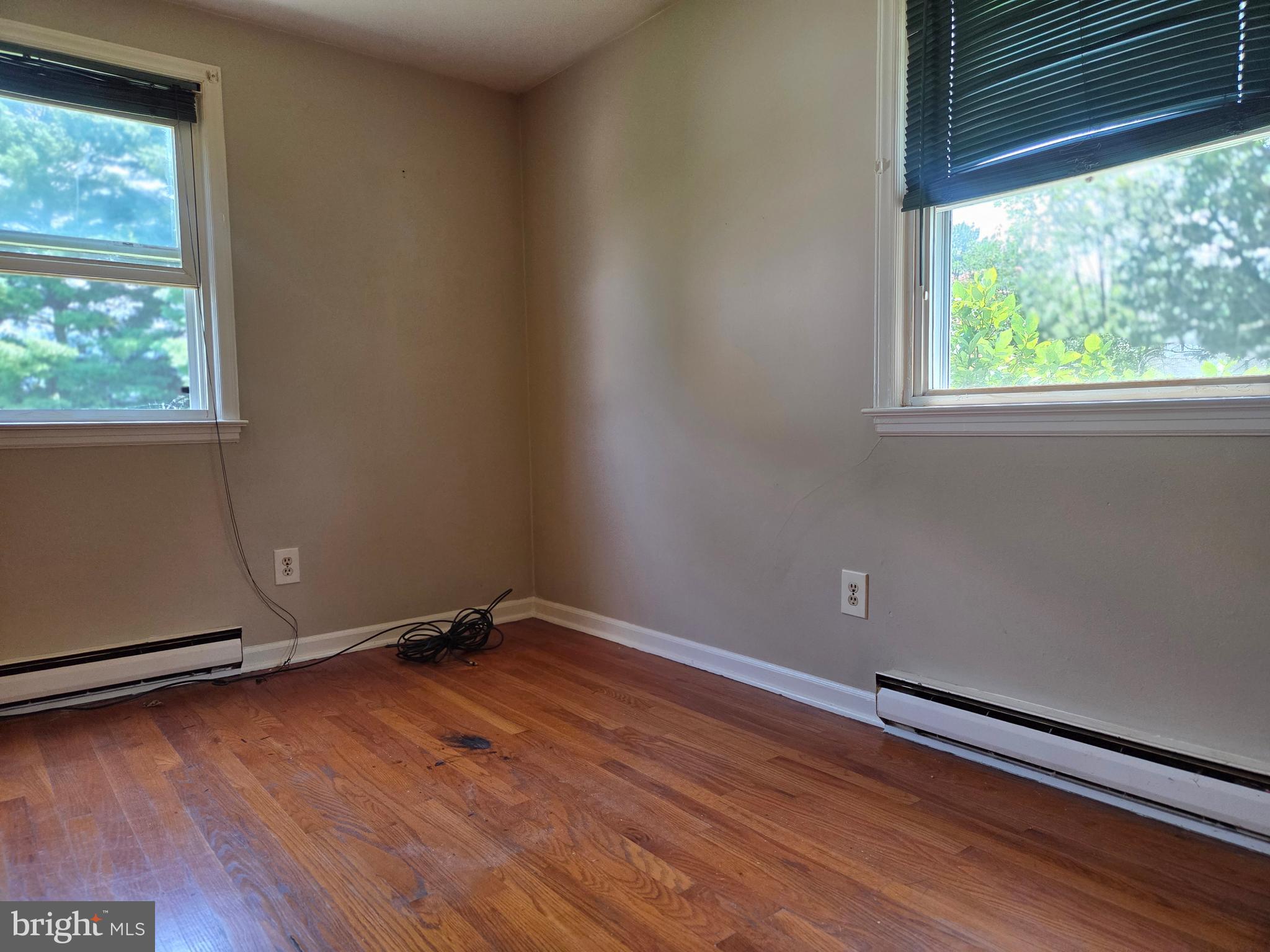 5880 Cardinal Street Mount Jackson, VA 22842 - Photo 28 of 44 an empty room with wooden floor and windows