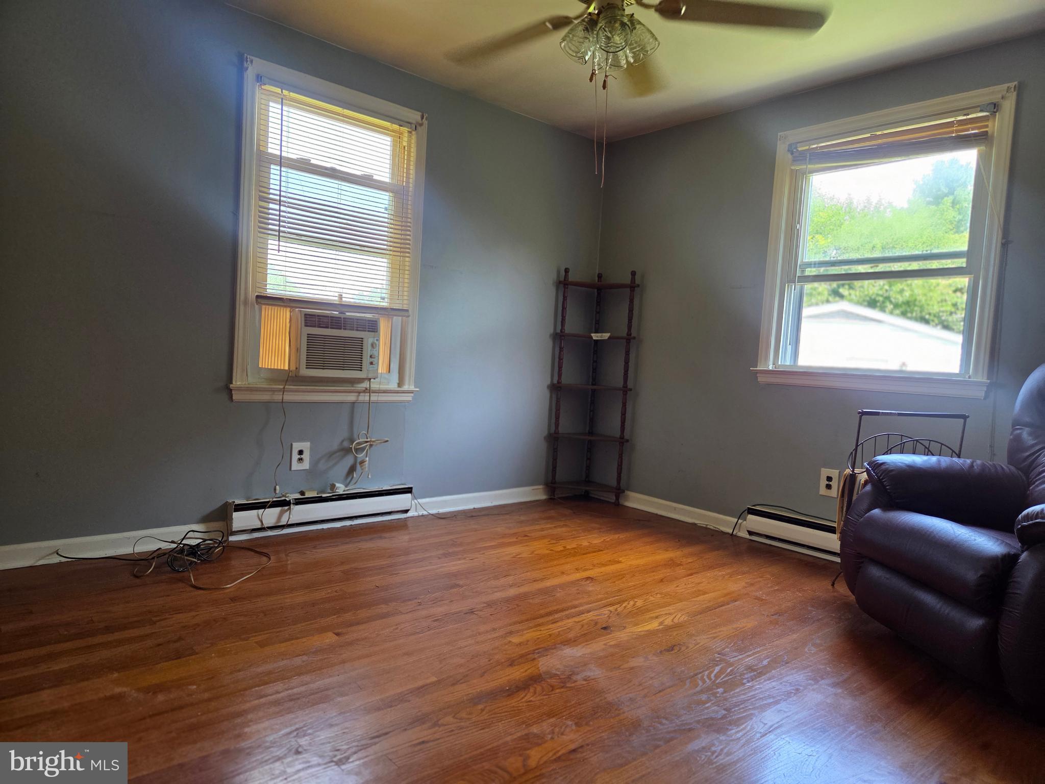 5880 Cardinal Street Mount Jackson, VA 22842 - Photo 31 of 44 a view of an empty room with a window and wooden floor