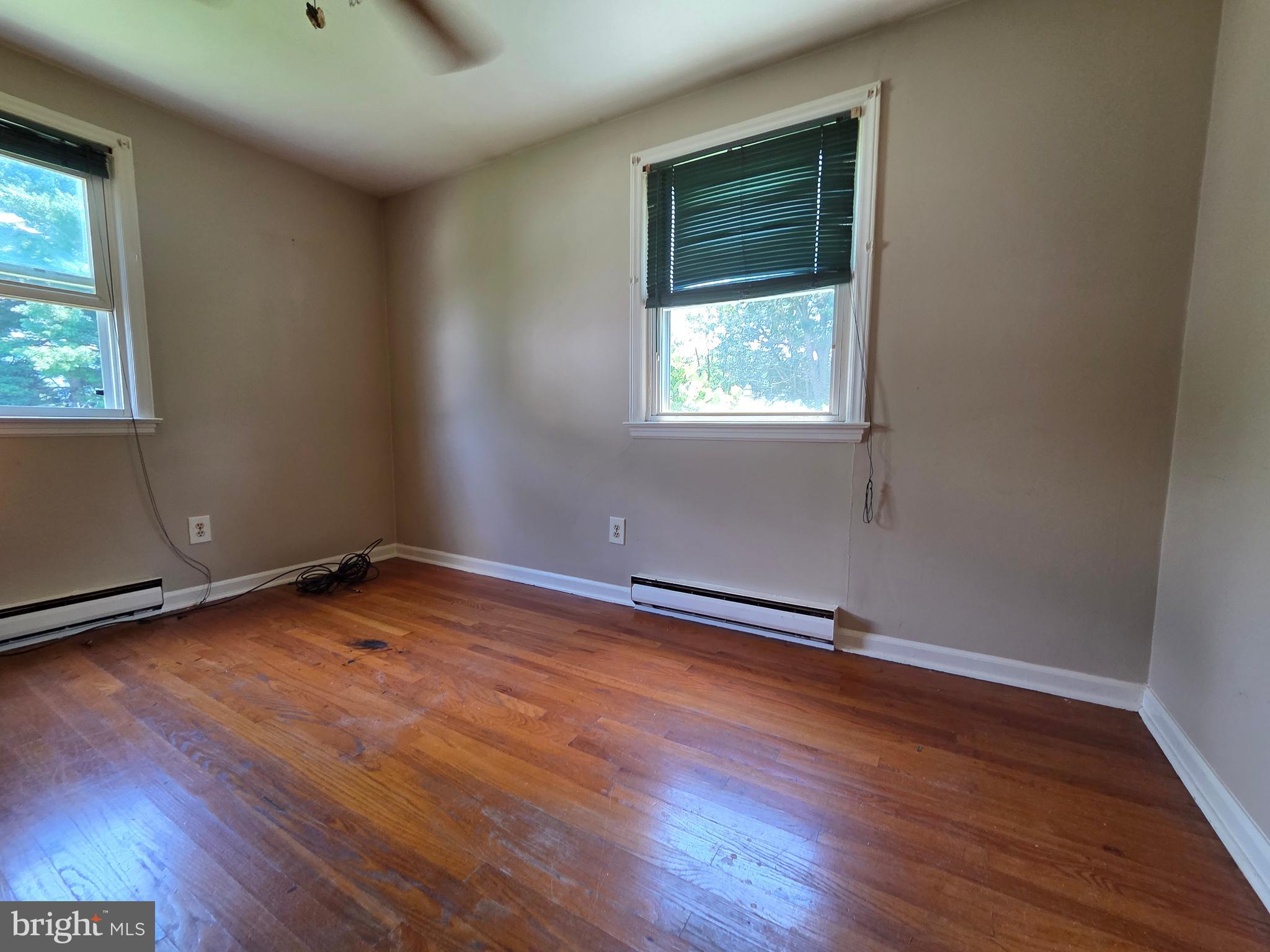 5880 Cardinal Street Mount Jackson, VA 22842 - Photo 36 of 44 an empty room with wooden floor and windows
