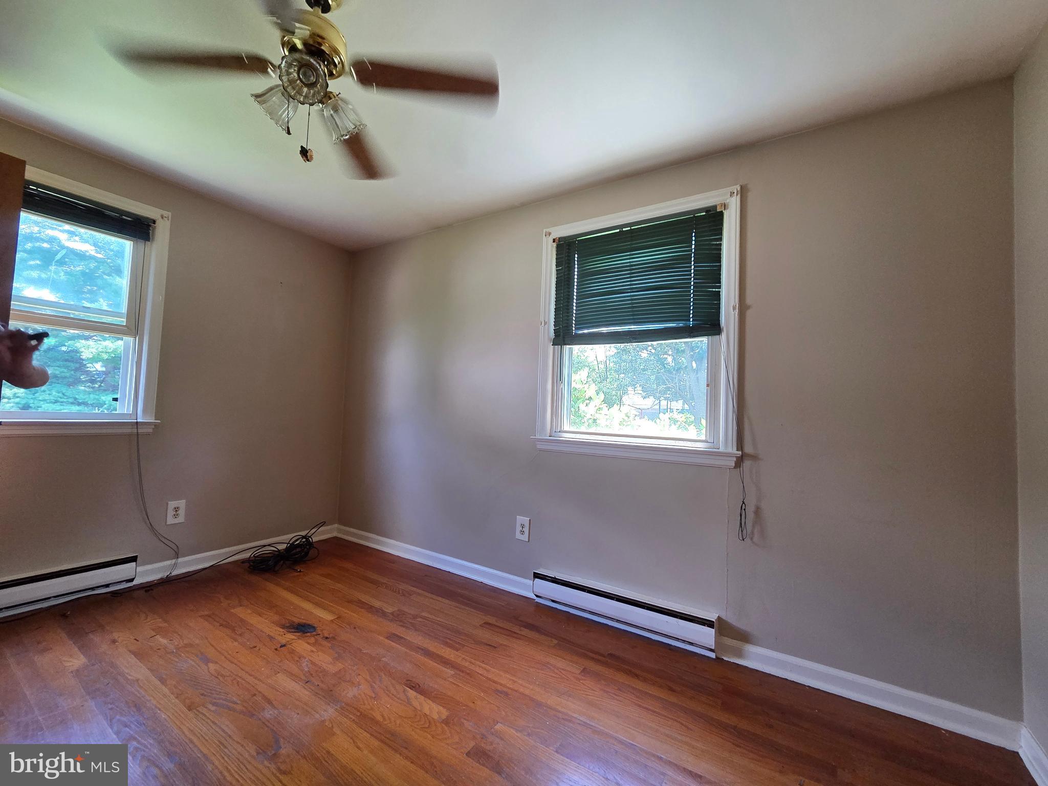 5880 Cardinal Street Mount Jackson, VA 22842 - Photo 37 of 44 an empty room with wooden floor fan and windows