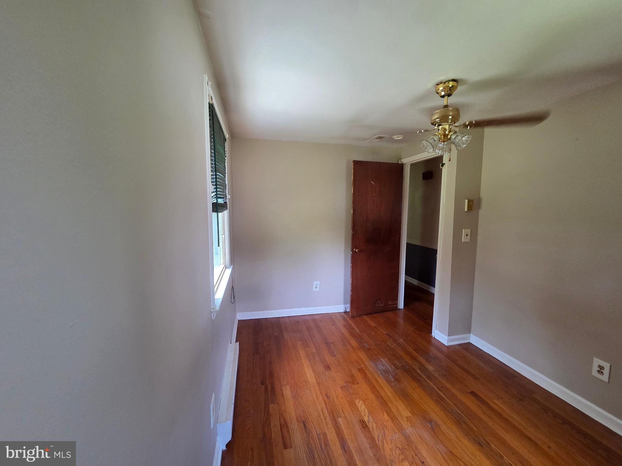 5880 Cardinal Street Mount Jackson, VA 22842 - Photo 39 of 44 a view of a hallway with wooden floor and a chandelier