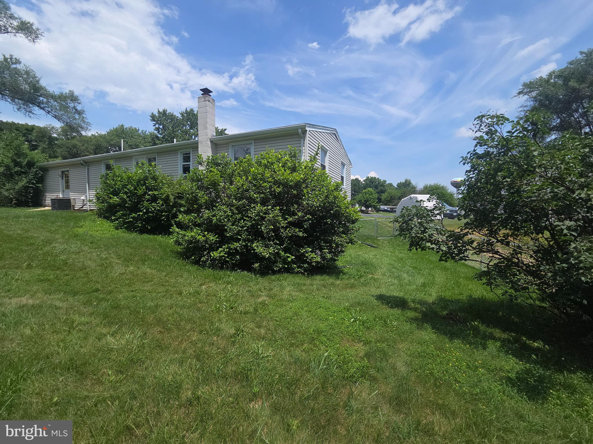 5880 Cardinal Street Mount Jackson, VA 22842 - Photo 8 of 44 a view of a garden with a building in the background