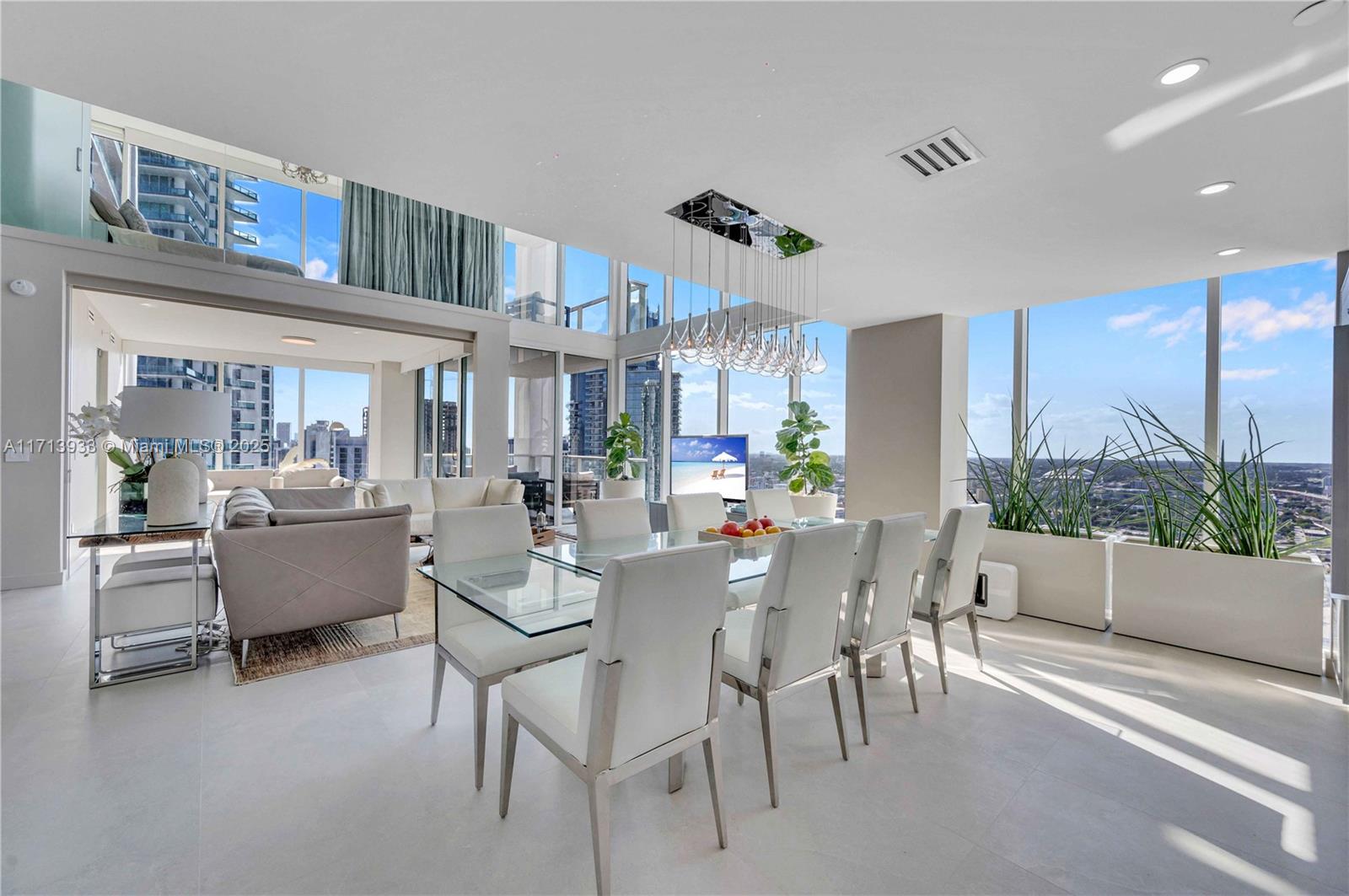 1040 Biscayne Boulevard, Unit LPH4407 Miami, FL 33132 - Photo 19 of 66 dining area with living room