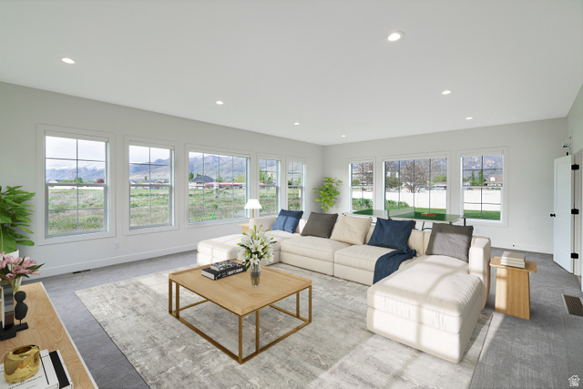 1952 South Comanche Circle Farmington, UT 84025 - Photo 40 of 52 Living room featuring a mountain view and recessed lighting