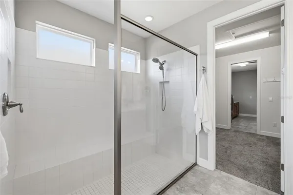 a kitchen with stainless steel appliances granite countertop a sink and a refrigerator