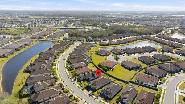an aerial view of a house with a ocean view