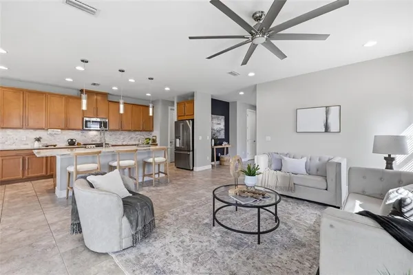 a kitchen with stainless steel appliances granite countertop a sink and cabinets