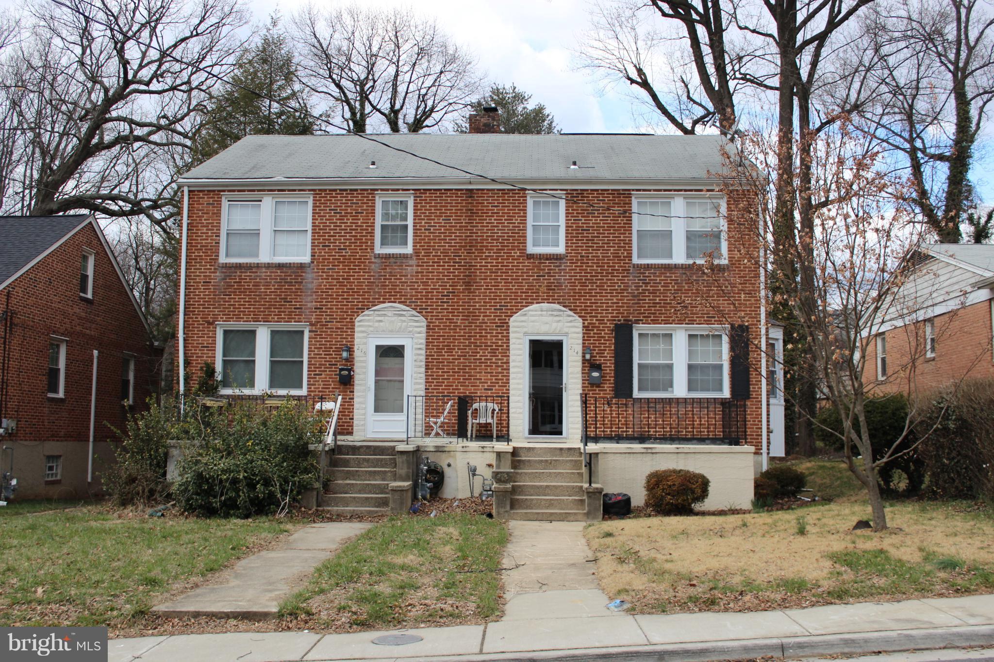 214 Mt De Sales Road Baltimore, MD 21229 - Photo 1 of 29 a front view of a house with garden