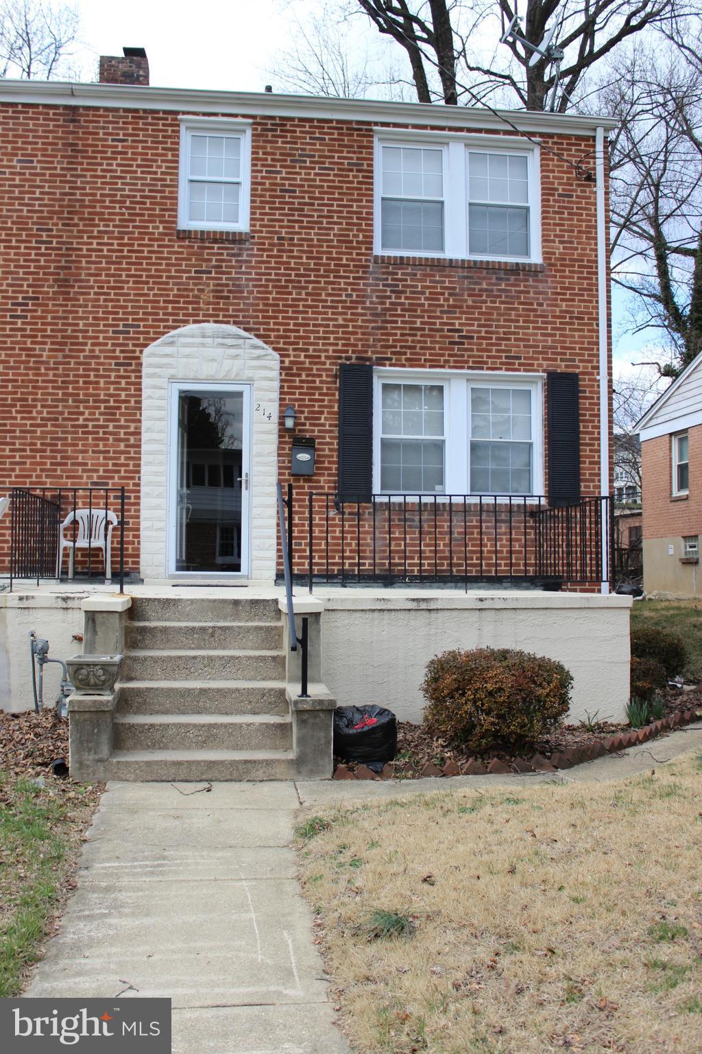 214 Mt De Sales Road Baltimore, MD 21229 - Photo 2 of 29 a front view of a house with a yard