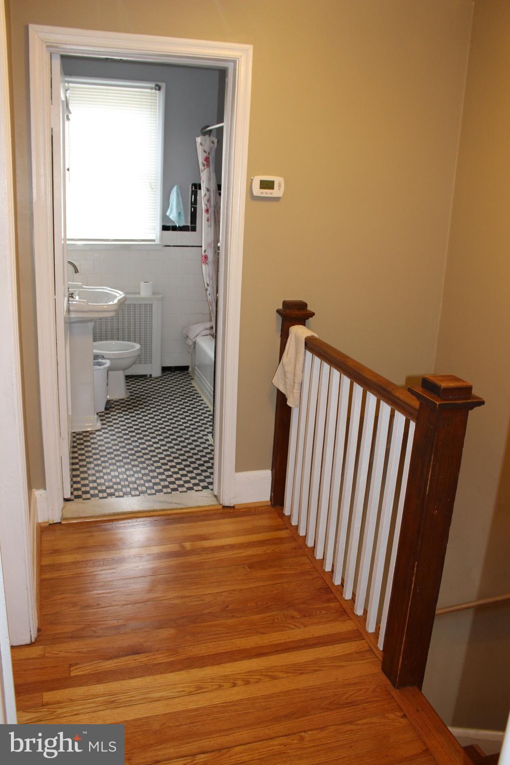 214 Mt De Sales Road Baltimore, MD 21229 - Photo 12 of 29 a view of a hallway view with wooden floor and staircase