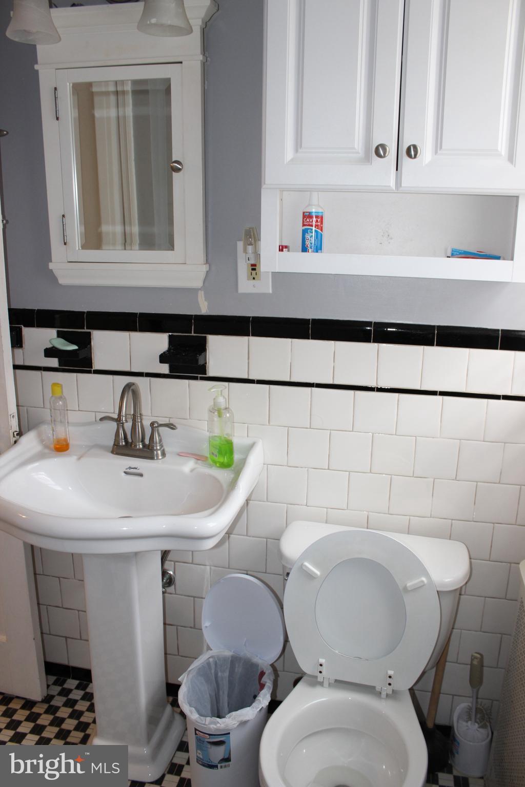 214 Mt De Sales Road Baltimore, MD 21229 - Photo 14 of 29 a bathroom with a toilet and a sink