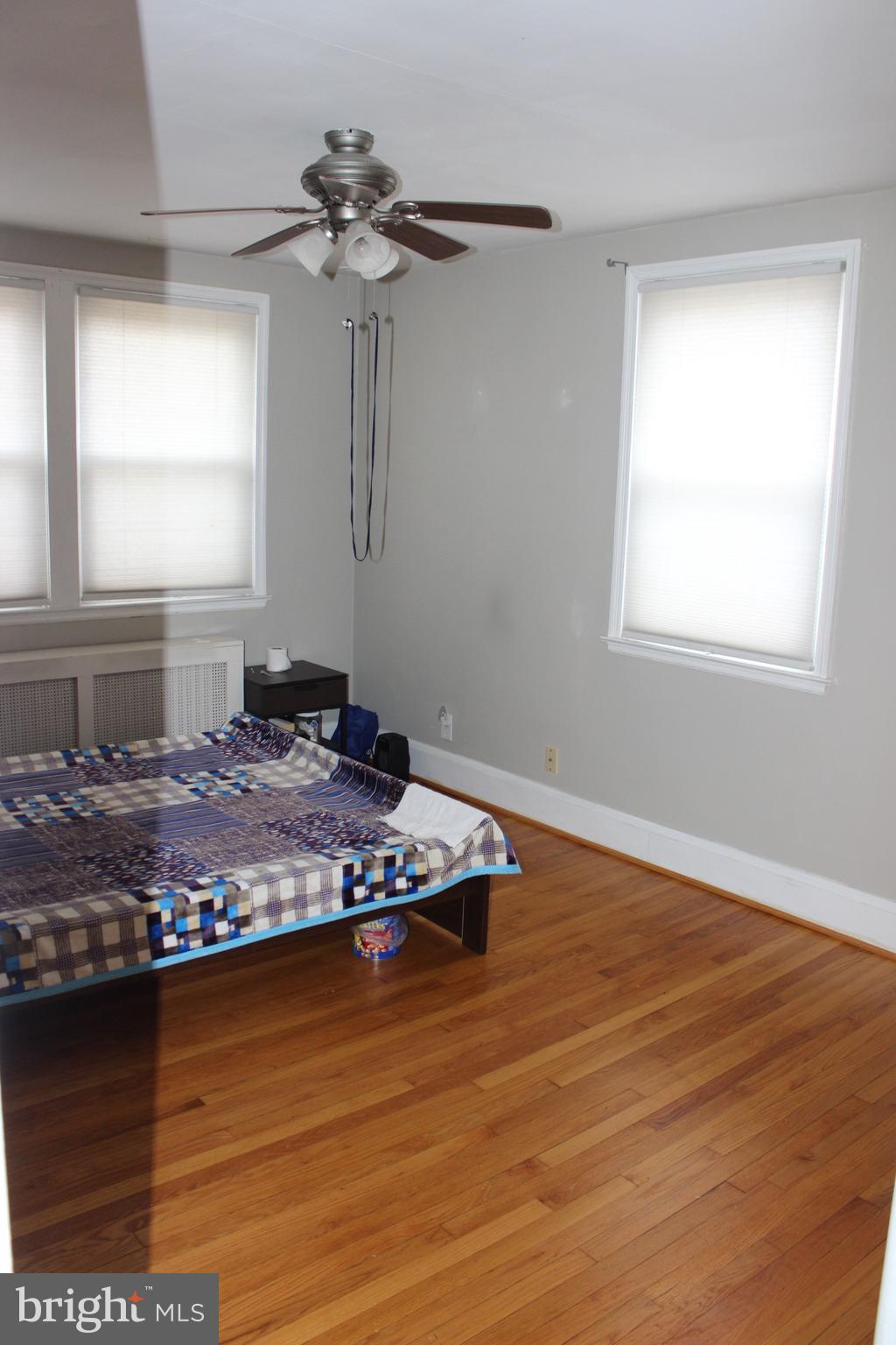 214 Mt De Sales Road Baltimore, MD 21229 - Photo 16 of 29 a living room with hard wood floors and a window