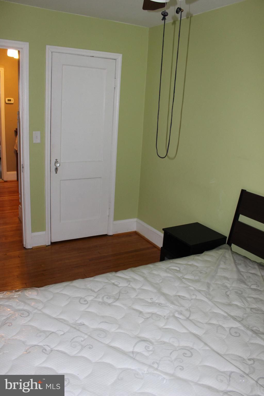 214 Mt De Sales Road Baltimore, MD 21229 - Photo 18 of 29 a bedroom with a bed and a window