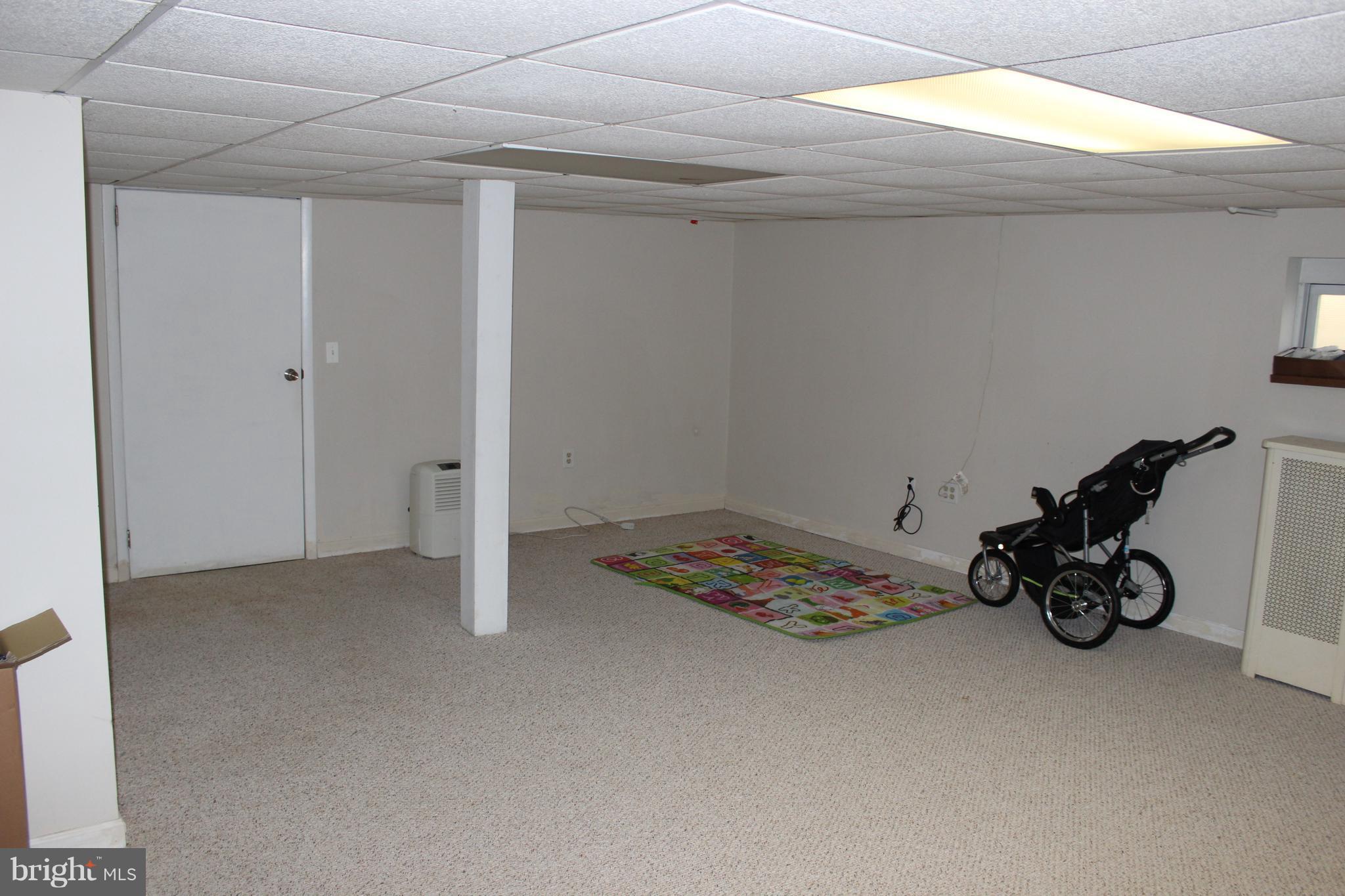 214 Mt De Sales Road Baltimore, MD 21229 - Photo 22 of 29 a view of a room with rack and bicycle