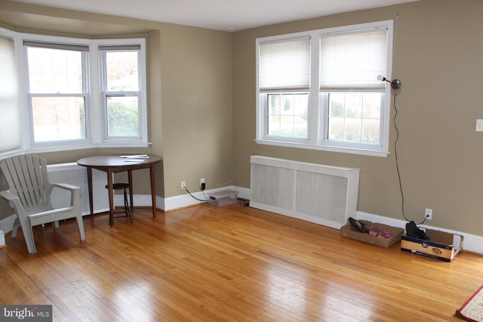 214 Mt De Sales Road Baltimore, MD 21229 - Photo 5 of 29 a view of a workspace with furniture and a window