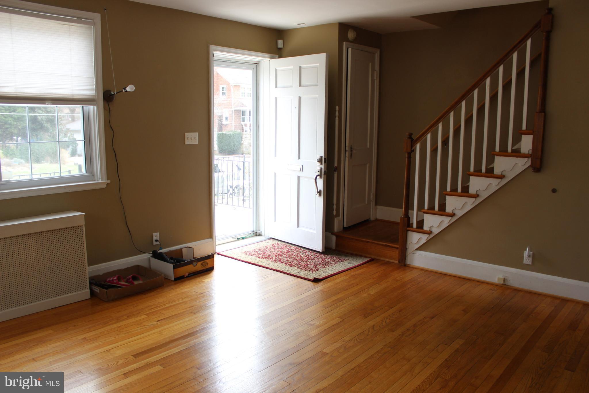 214 Mt De Sales Road Baltimore, MD 21229 - Photo 6 of 29 a view of entryway with wooden floor and stairs