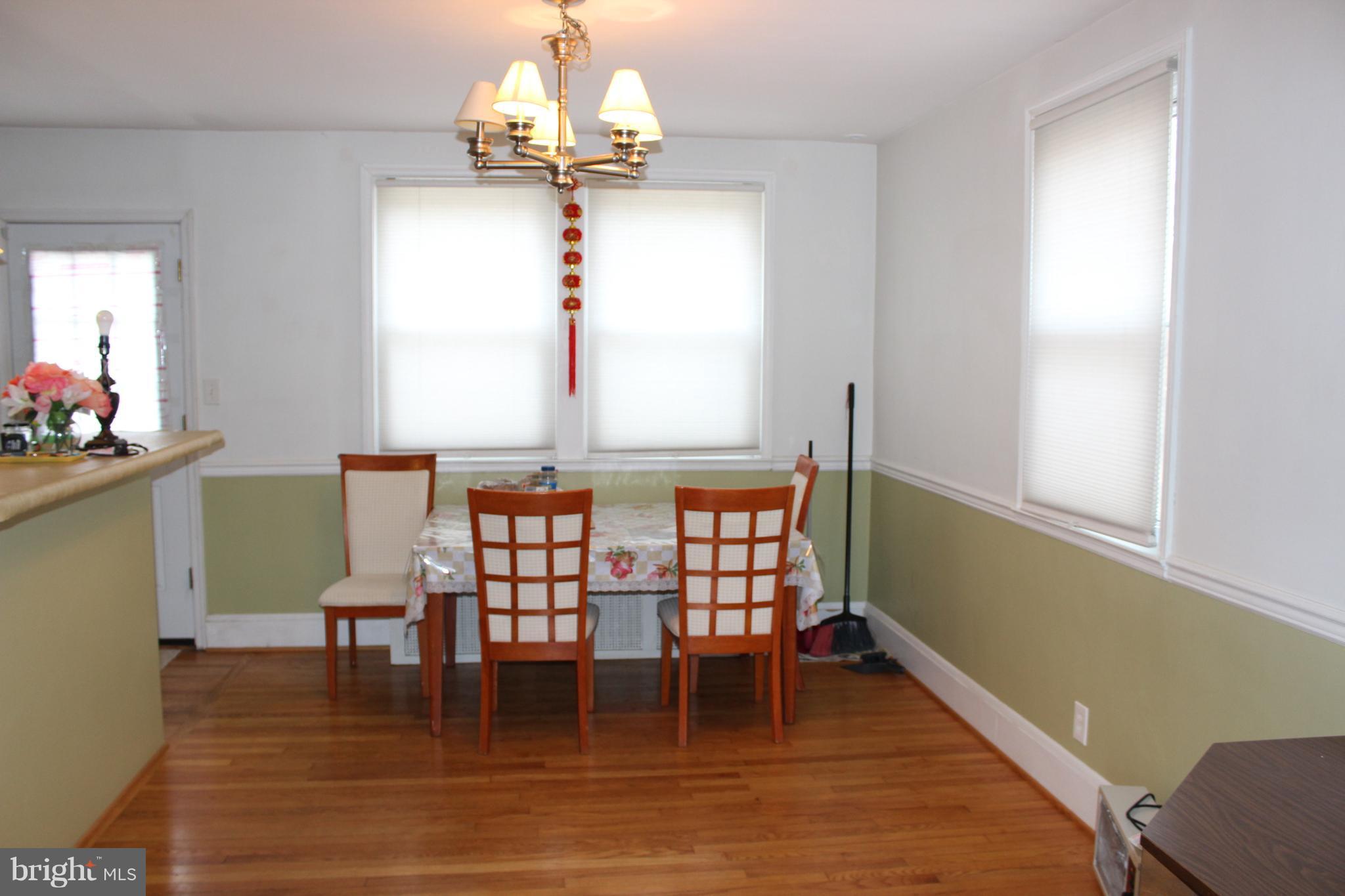 214 Mt De Sales Road Baltimore, MD 21229 - Photo 8 of 29 a view of a dining room with furniture window and wooden floor
