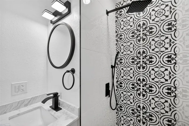 an aerial view of residential houses with outdoor space and swimming pool