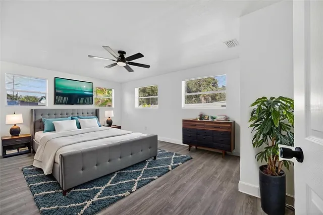 an aerial view of residential houses with outdoor space and parking