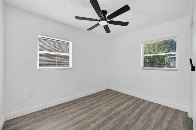 an aerial view of residential houses with city view