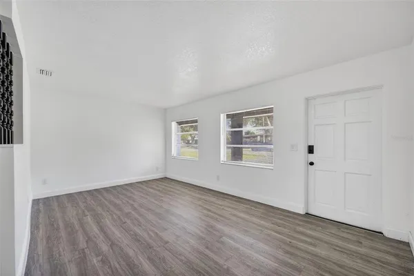 a kitchen with stainless steel appliances a stove a sink and a refrigerator