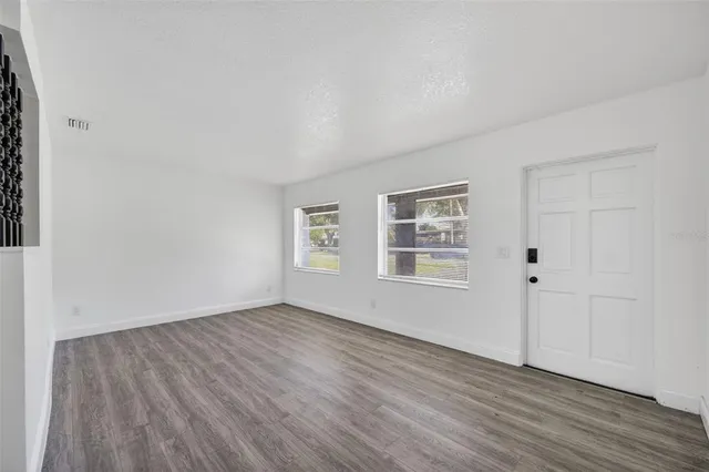 a kitchen with stainless steel appliances a stove a sink and a refrigerator