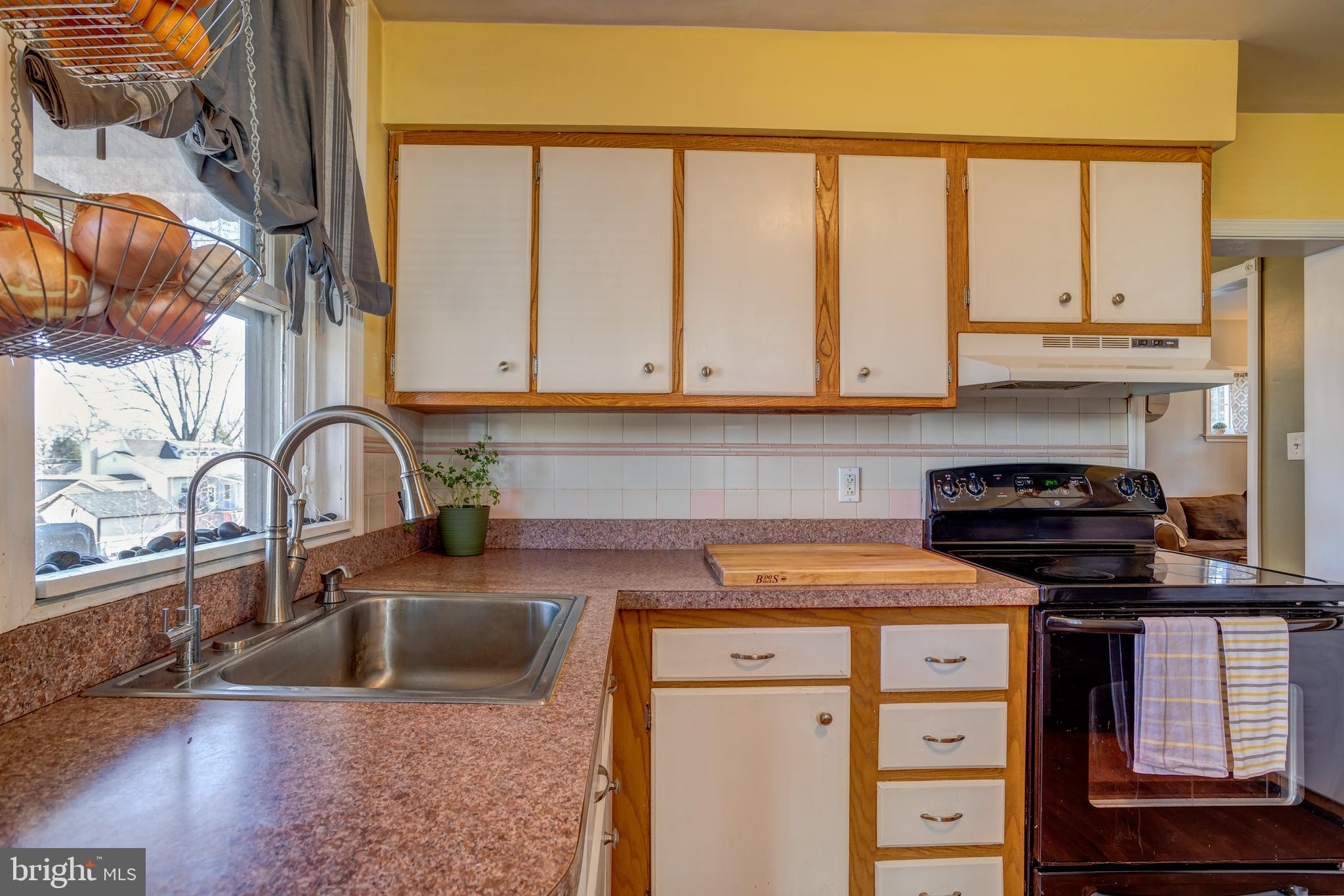 2515 Dutton Mill Road Aston, PA 19014 - Photo 14 of 35 a kitchen with stainless steel appliances granite countertop a stove a sink and a microwave