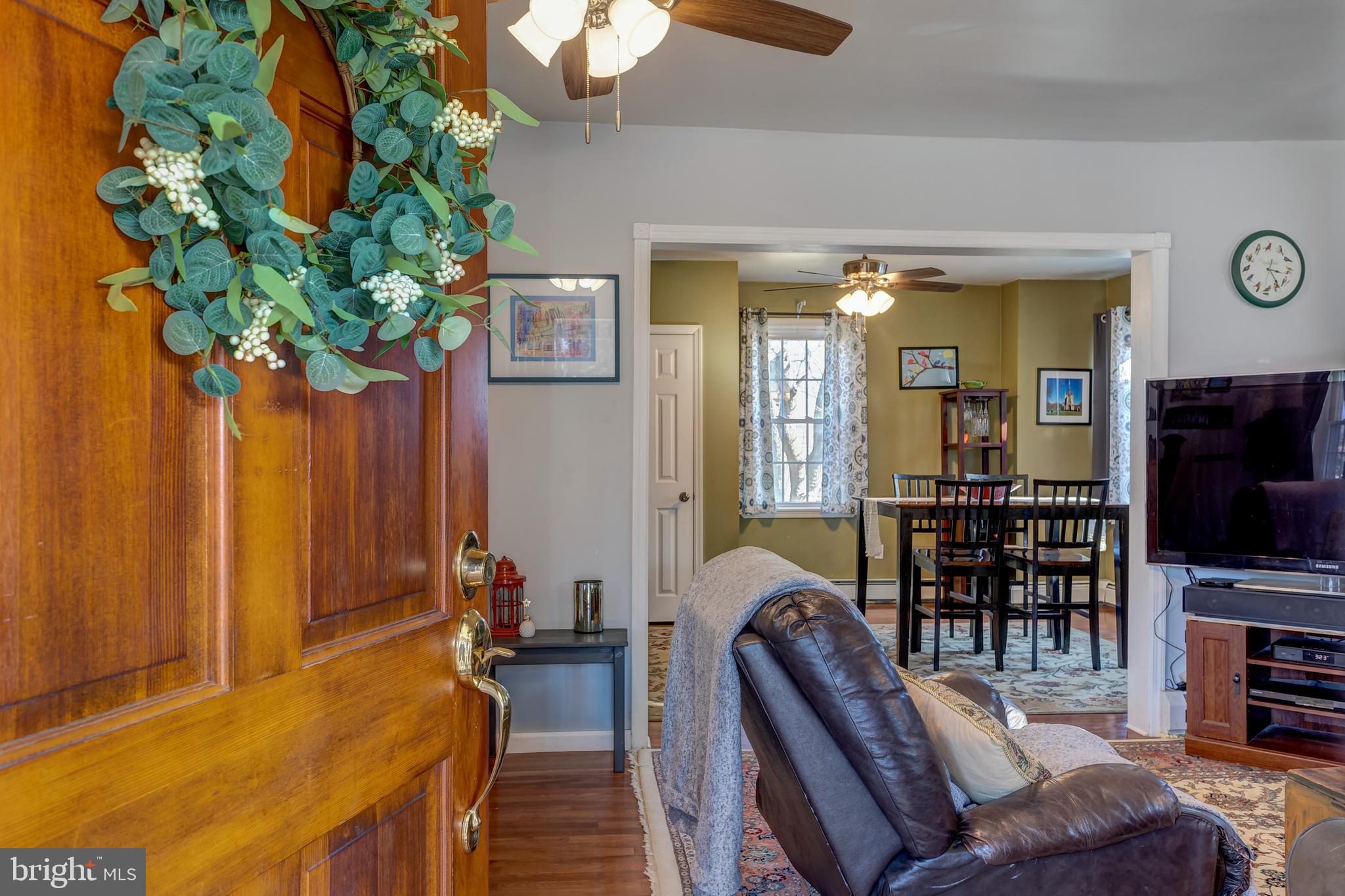 2515 Dutton Mill Road Aston, PA 19014 - Photo 4 of 35 a living room with furniture a flat screen tv and a potted plant