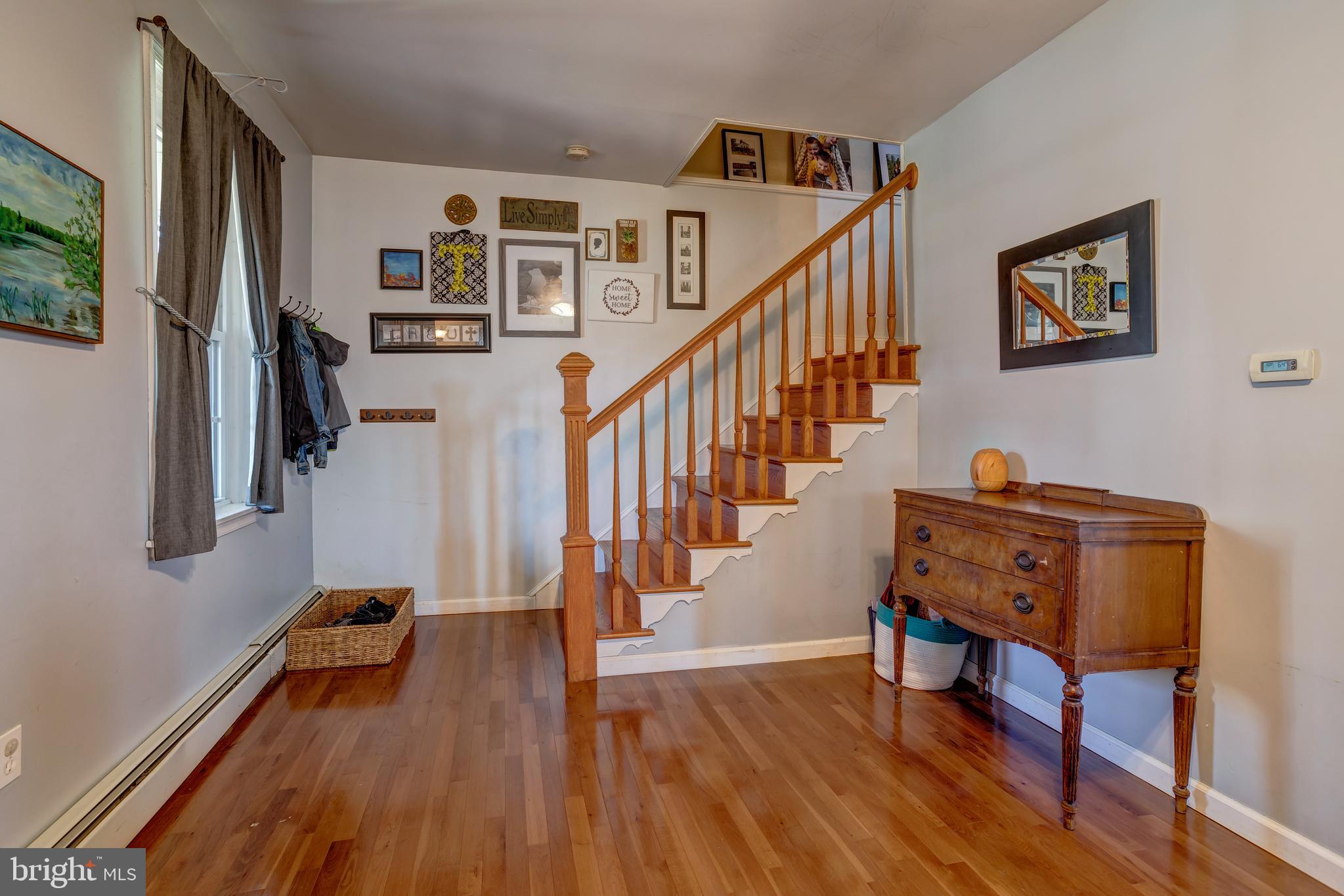 2515 Dutton Mill Road Aston, PA 19014 - Photo 5 of 35 a hallway with wooden floor and furniture