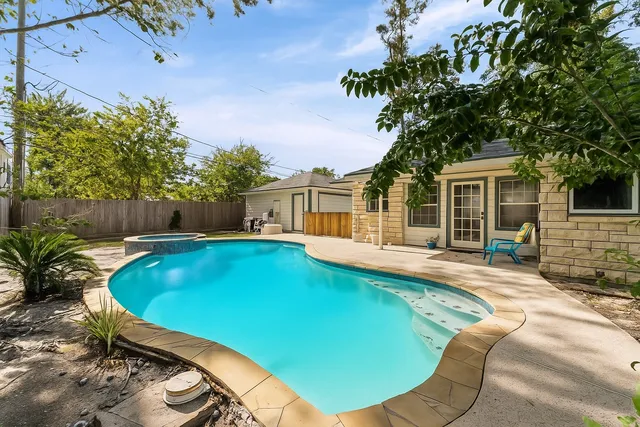 a view of a house with swimming pool