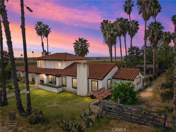 a view of a swimming pool with a table and chairs
