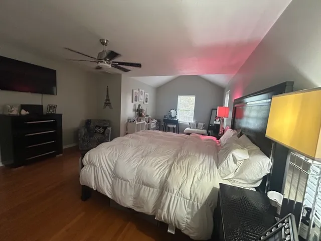 a bed room with a bed and a television