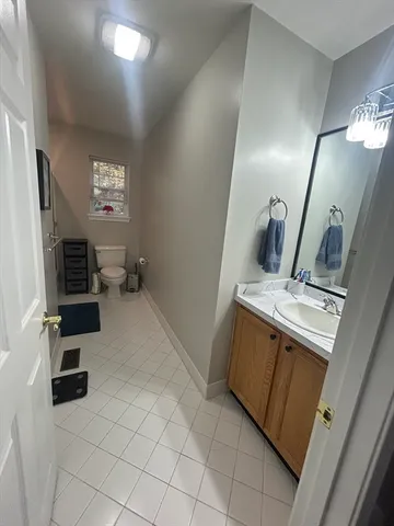 a view of kitchen with furniture and electronic appliances