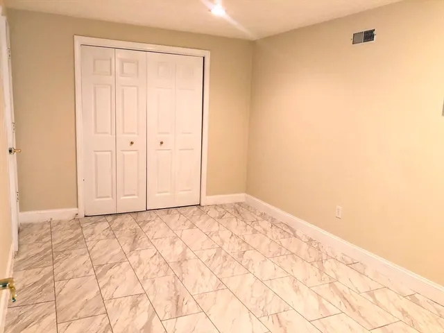 a bathroom with a toilet sink and shower
