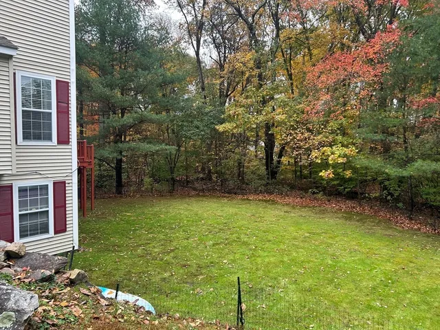 a backyard of a house with lots of green space