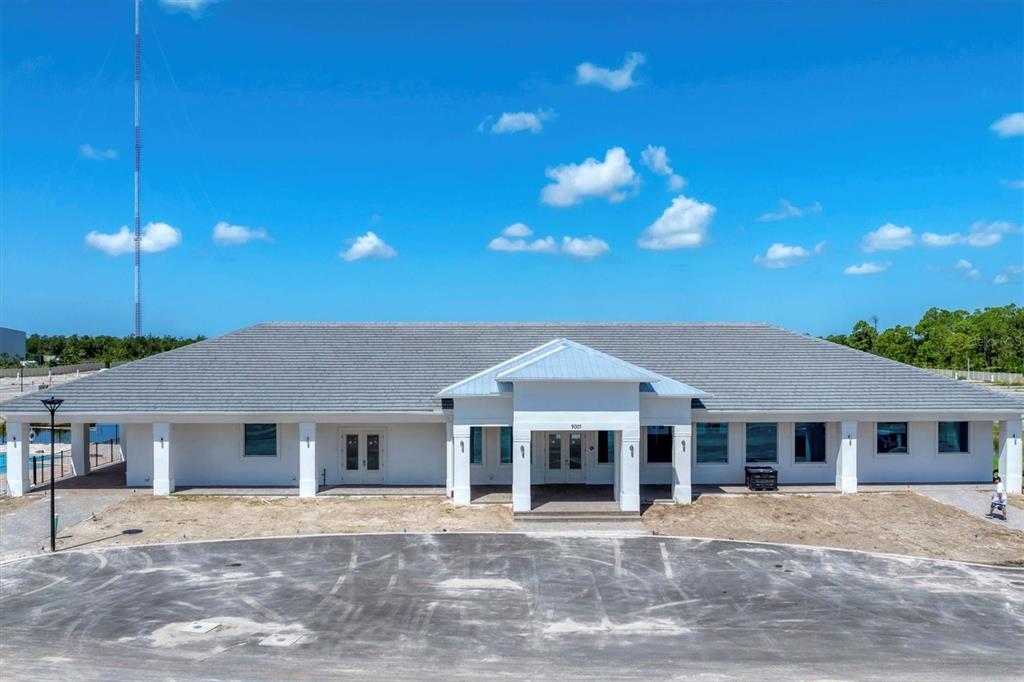 9001 Gasparilla Road, Unit 87 Placida, FL 33947 - Photo 27 of 75 a front view of a house with a yard