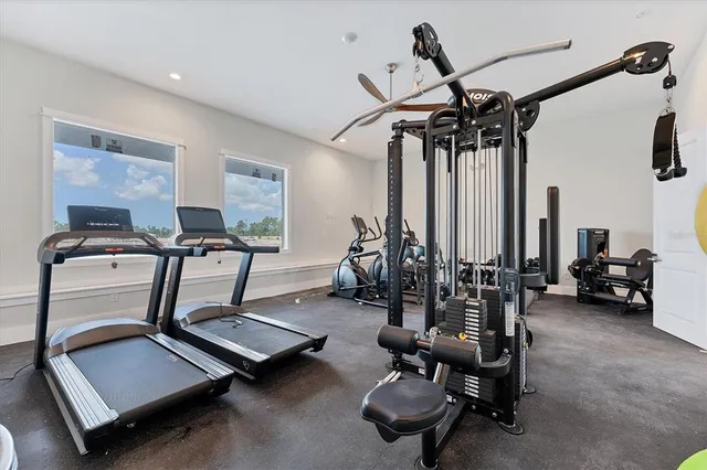 a view of a swimming pool is middle in the backyard