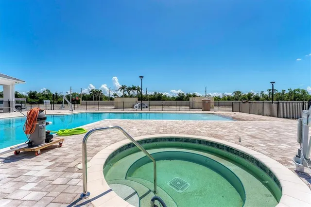 a view of a swimming pool with an outdoor space and seating area