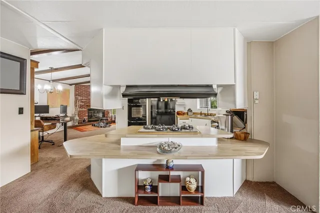 a kitchen with a table and chairs