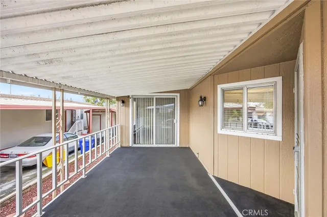 a view of an entryway with wooden floor