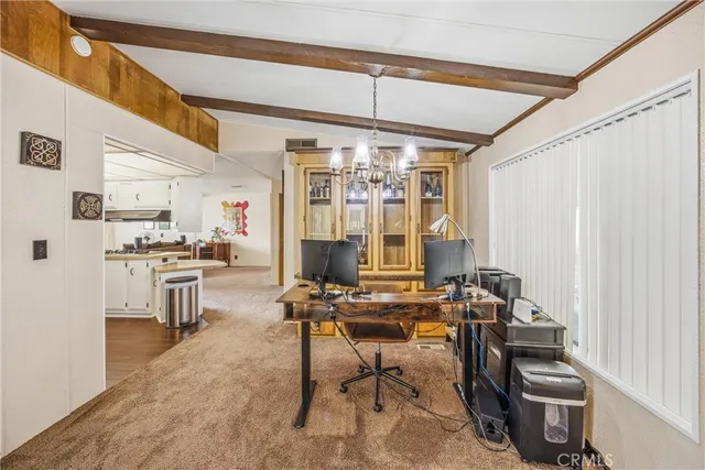 a room with furniture a flat screen tv and a window