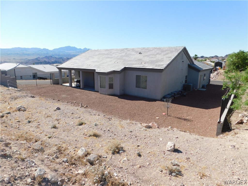 3370 South Ridge Avenue Bullhead City, AZ 86429 - Photo 12 of 56 a view of a house with a yard