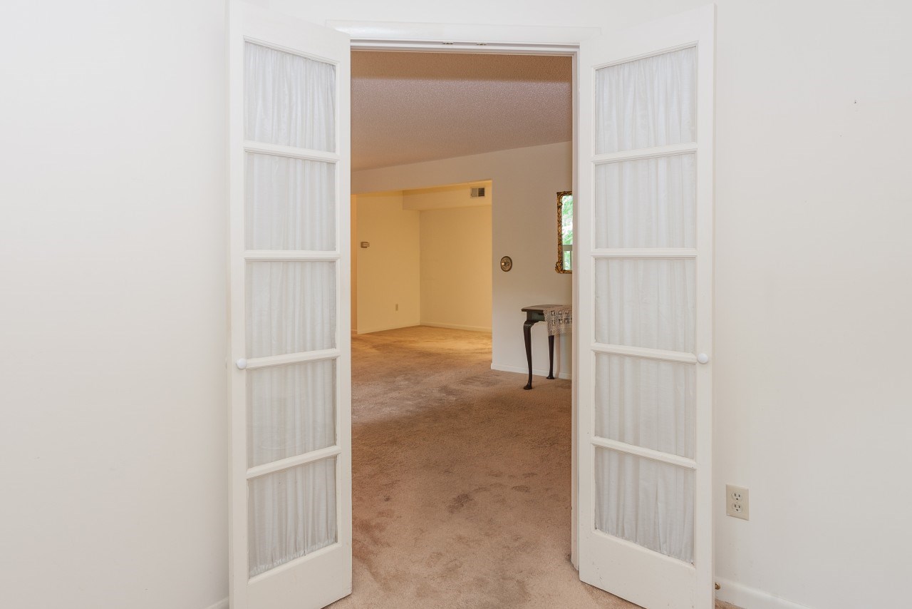 113 Turtle Creek Road, Unit 7 Charlottesville, VA 22901 - Photo 12 of 32 a view of a bathroom from a hallway