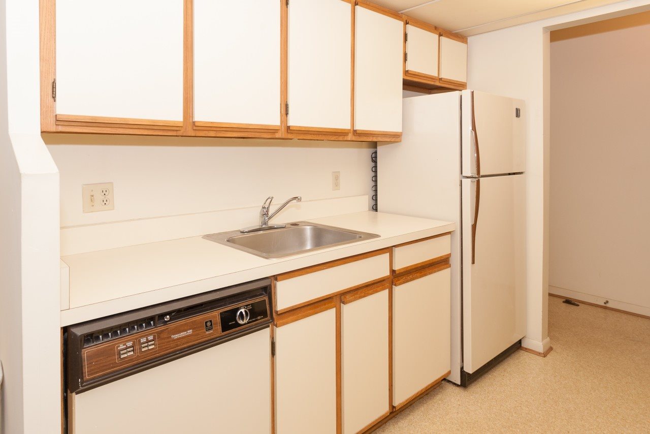 113 Turtle Creek Road, Unit 7 Charlottesville, VA 22901 - Photo 6 of 32 a kitchen with stainless steel appliances a sink and a refrigerator