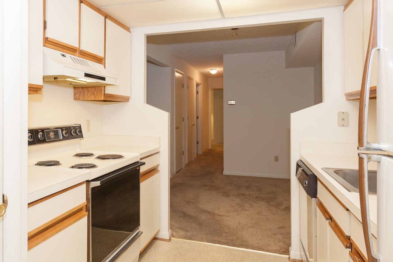 113 Turtle Creek Road, Unit 7 Charlottesville, VA 22901 - Photo 7 of 32 a kitchen with a stove and a refrigerator